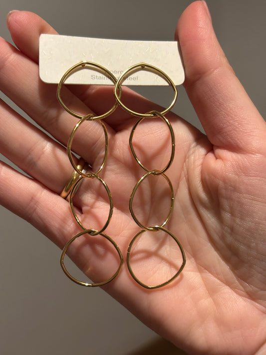 Pendiente acero dorado