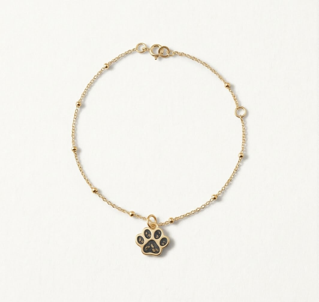 Pulsera memorial con cenizas huella dorada